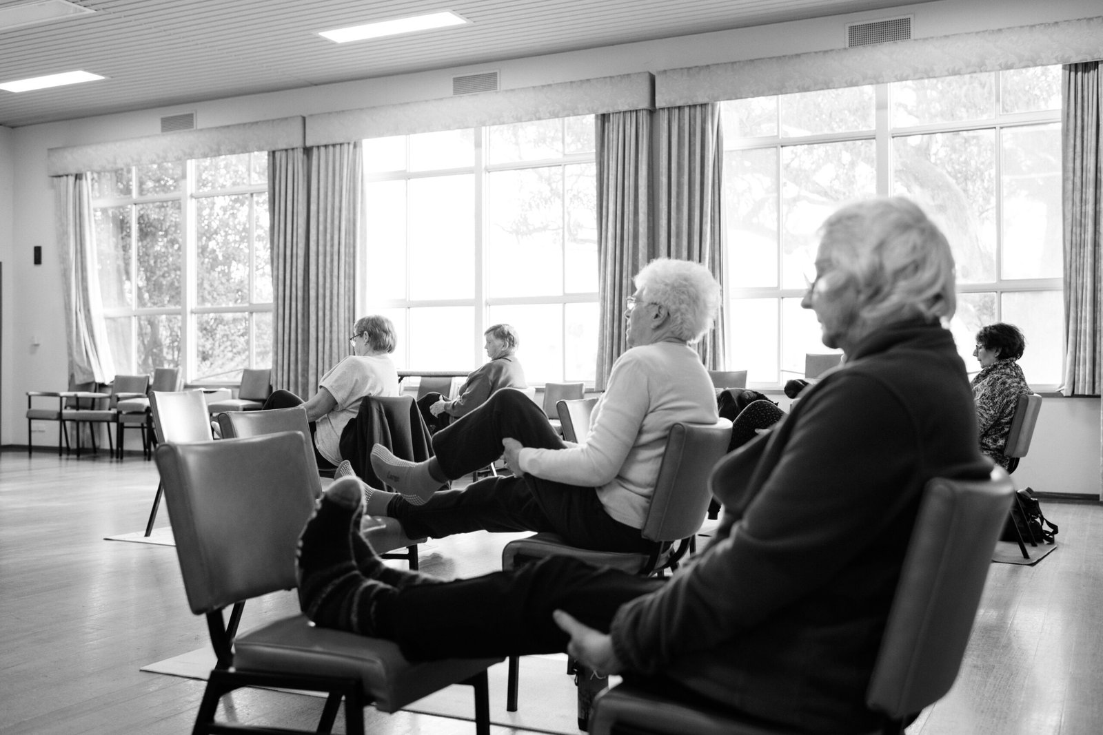 Lady doing Yoga in group
